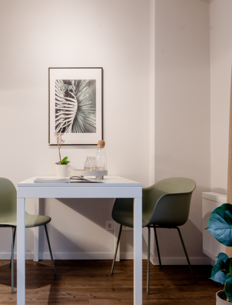 View of the studio's table and chairs next to kitchen