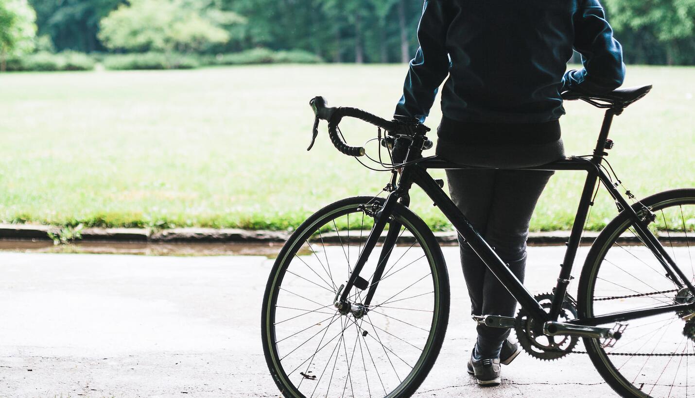 Person on a bike in front of the nature