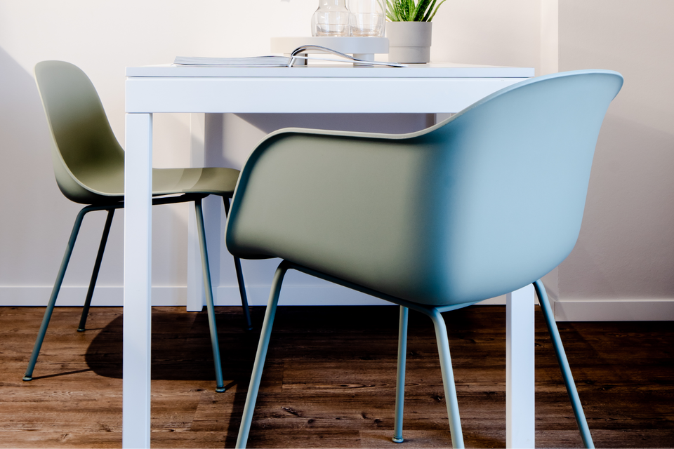 White table with green chairs